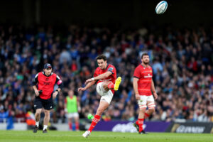 Joey Carbery takes a kick at goal.