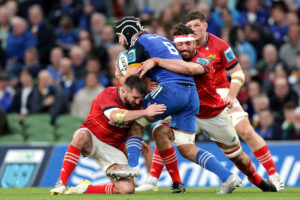 Caelan Doris is tackled by Diarmuid Barron and Jean Kleyn.