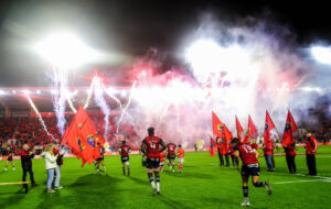 The Munster team run out at Páirc Uí Chaoimh.