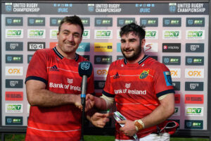 John Hodnett receives his Player of the Match award from Niall Scannell.