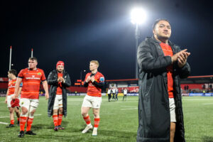 Roman Salanoa applauds the fans after the game.