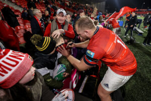 Keynan Knox signs autographs for fans after the game.