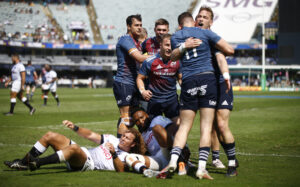 Shane Daly celebrates with Mike Haley after scoring the opening try.