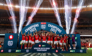 Munster celebrate with the trophy in Cape Town.