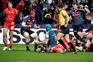 John Hodnett and Peter O'Mahony celebrate Tadhg Beirne's try.