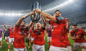 Calvin Nash, Keith Earls and Shane Daly celebrate with the URC trophy.