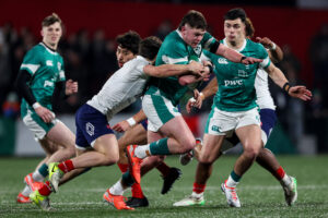 Eoghan Smyth in action for the Ireland U20s with Tom Wood (left) and Gene O'Leary Kareem (right).